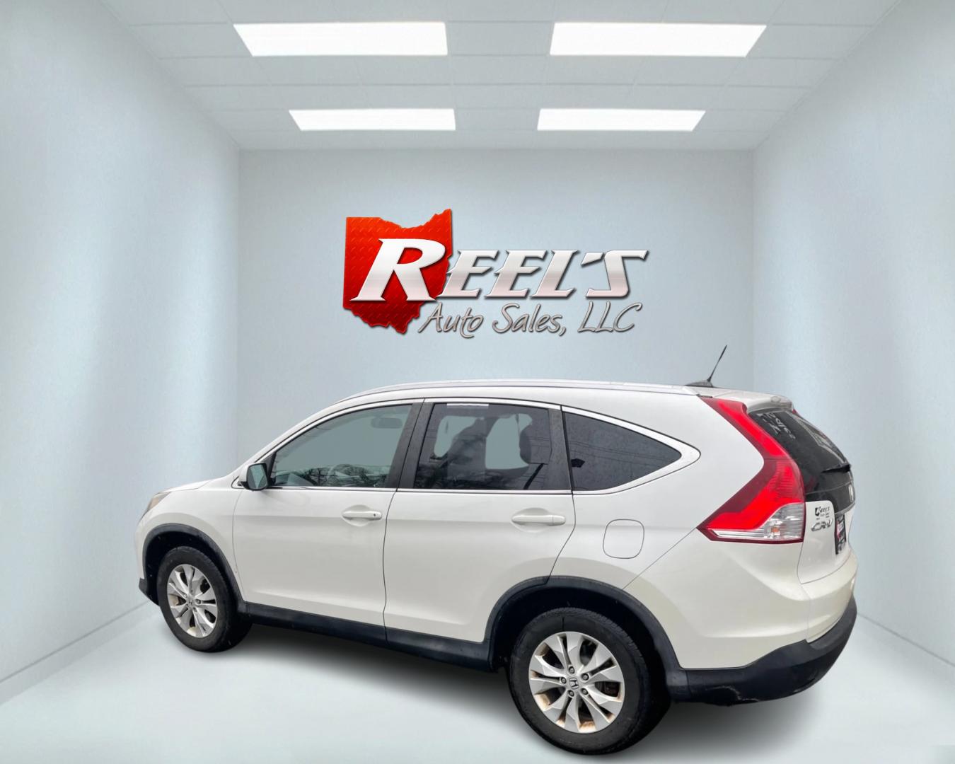 2013 White /Black Honda CR-V EX-L 4WD 5-Speed AT (5J6RM4H71DL) with an 2.4L I4 DOHC 16V engine, 5-Speed Automatic transmission, located at 11115 Chardon Rd. , Chardon, OH, 44024, (440) 214-9705, 41.580246, -81.241943 - This 2013 Honda CR-V EX-L AWD boasts a reliable 2.4L engine paired with a 5-speed automatic transmission, catering to drivers seeking both efficiency and all-wheel-drive capability. Its single-owner status may reassure potential buyers about its maintenance history. Luxurious features such as a leat - Photo#10